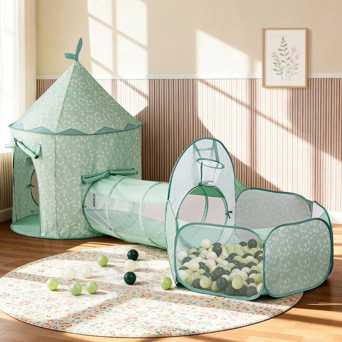 The Tiny Land® Green Adventure 3-in-1 Play Tunnel & Fun-Shapes Ocean Ball Set features a mint green tent and tunnel, plus a white floral ball pit with green, white, and gray balls—ideal for sensory play in stylish kids' rooms.