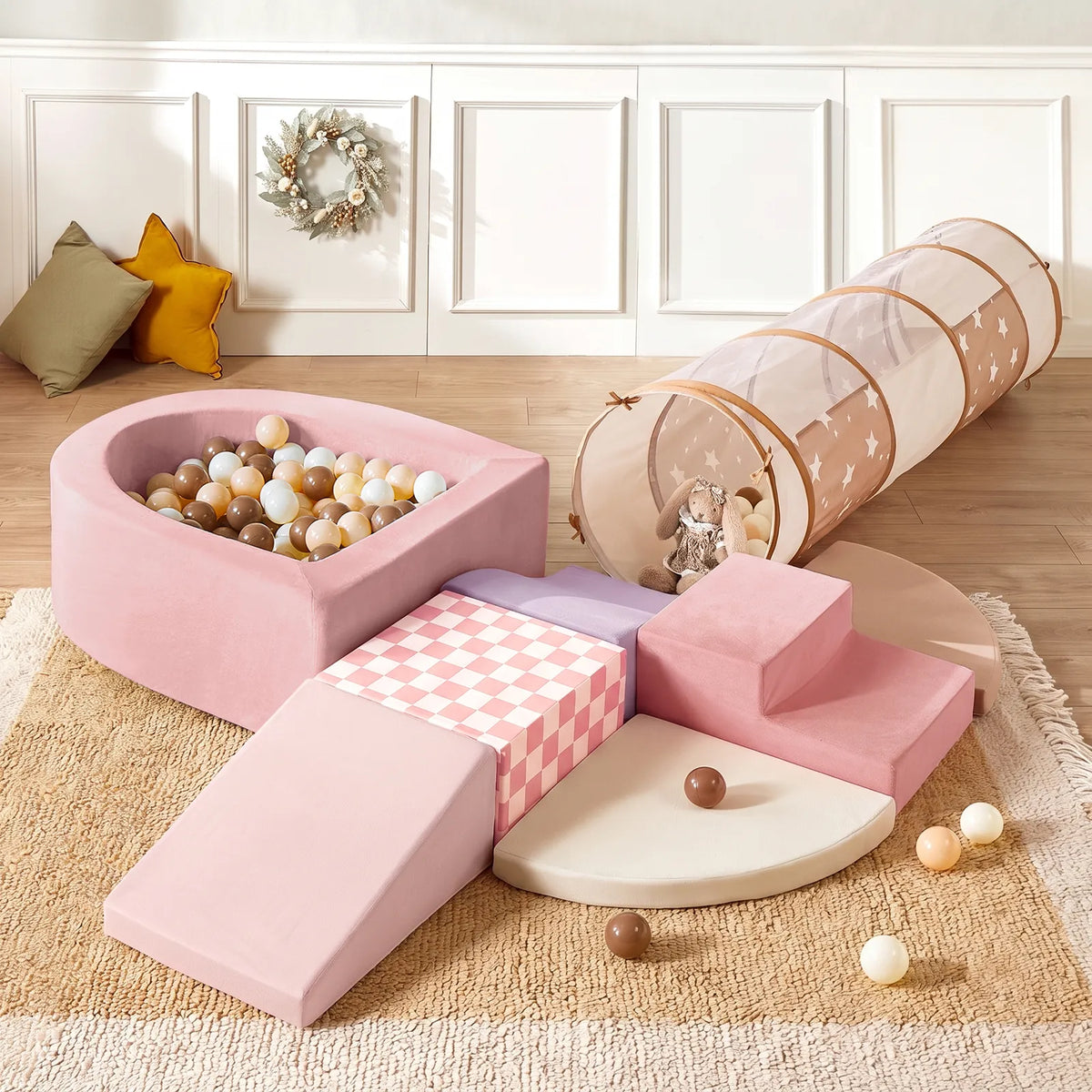 Transform your child's play area with the Tiny Land® Violet PlayNest Climbing Ball Pit Set with Tunnel by Tiny Land, featuring soft pastel hues and a cozy setup. This set includes foam steps, a slide, a foam ball pit filled with balls, a soft play tunnel, and plush cushions—perfect for indoor fun on a beige rug in a warm room adorned with white paneled walls and decorative pillows.|Pink