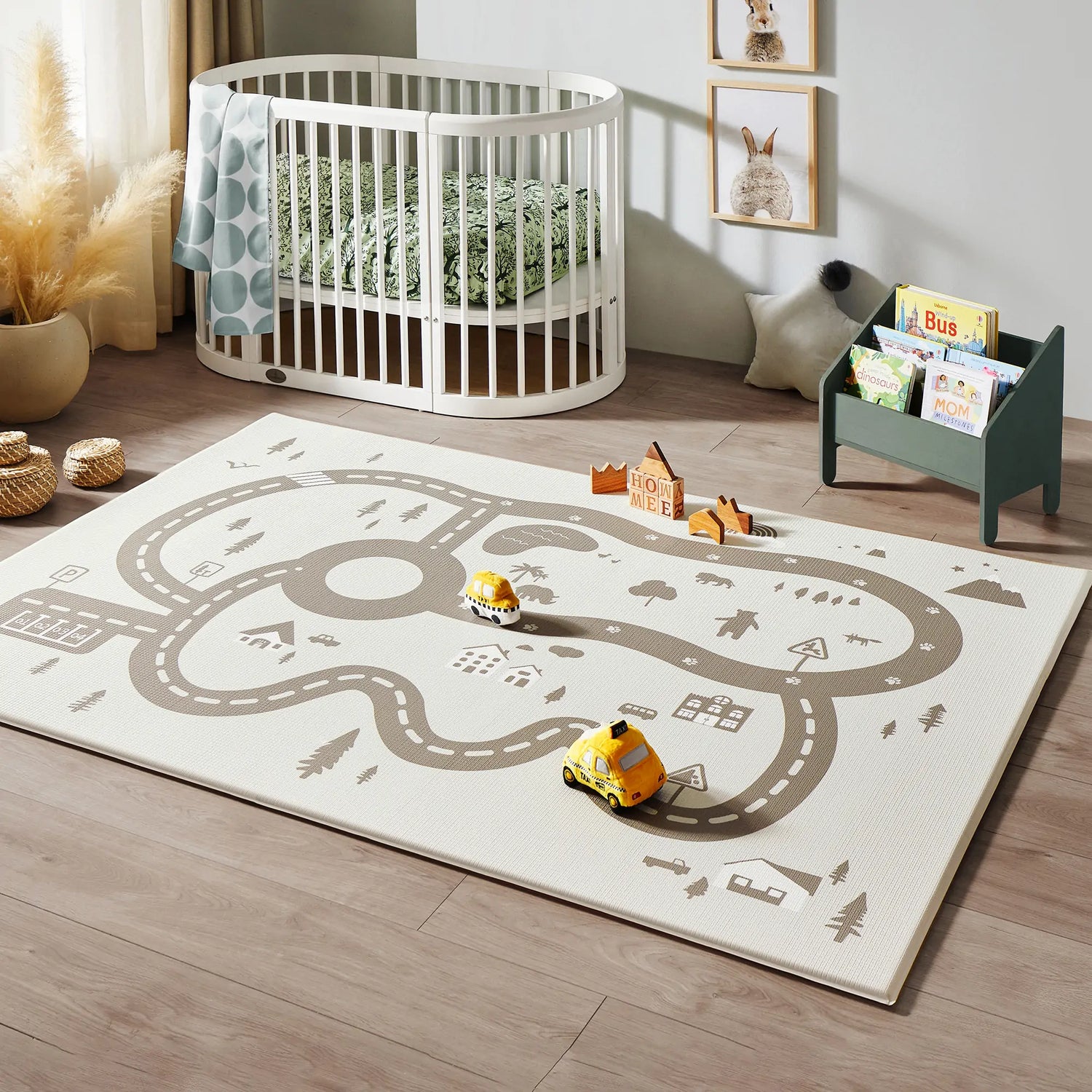 A well-arranged children's playroom with a train track play mat in the center.