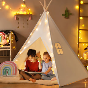 Two children sit inside the Tiny Land® Ultimate Reading Retreat: Premium Teepee & Corduroy Lounger by Tiny Land INC, their imaginations ignited as they read together in this cozy, Montessori-inspired space. The white kids teepee is softly illuminated with string lights and surrounded by plush toys, a cheerful rainbow decoration, and whimsical star ornaments on the wall—creating the perfect reading nook for little ones to enjoy.|Purple
