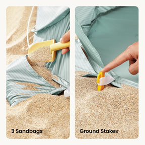 Split image: Left shows a hand filling the Tiny Land® 3-in-1 Baby Beach Tent’s sandbag pocket with sand using a yellow scoop. Right shows a hand securing a yellow stake through the white strap into sand. Text: 3 Sandbags and Ground Stakes.