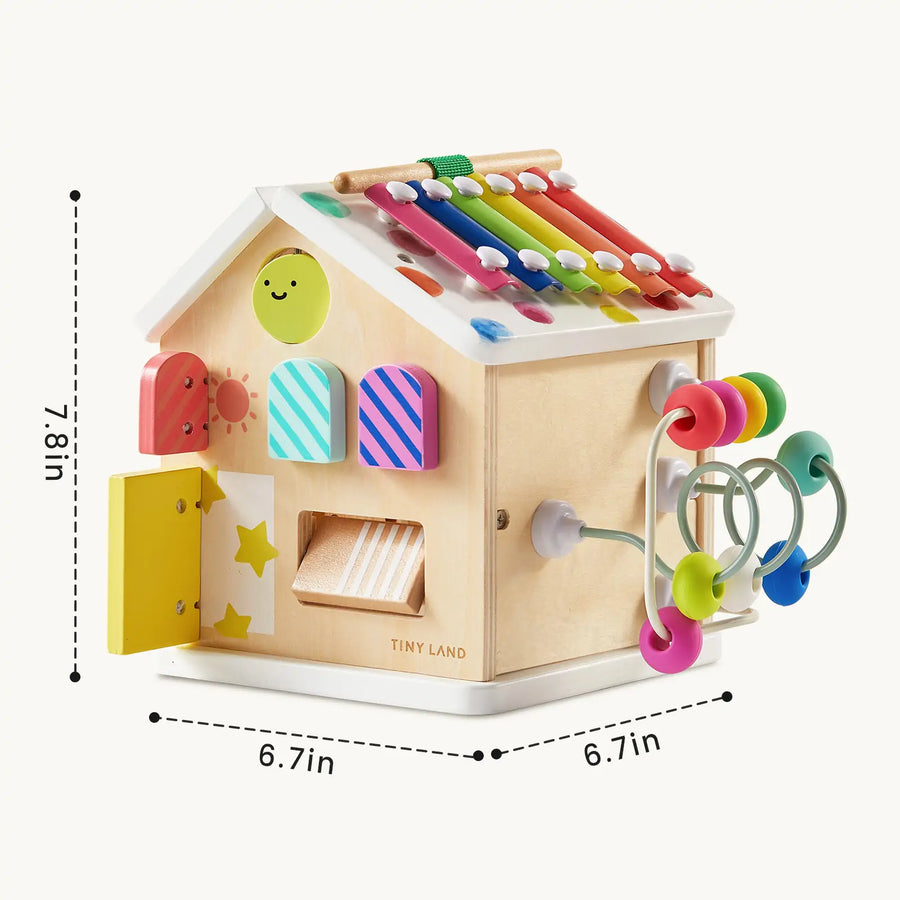 The Tiny Land® Cottage Activity Cube - Rainbow features colorful beads, a xylophone, spinning gears, and shape sorters on its sides. At 7.8" tall by 6.7" wide/deep, this Montessori toy is perfect for children’s play and learning activities.