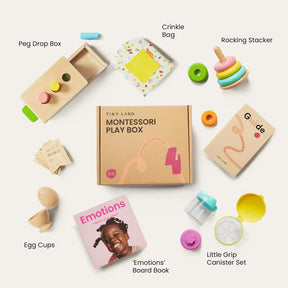 A flat lay of Tiny Land® Montessori Toys - Various Stages by Target, including a peg drop box, crinkle bag, emotions board book, and guide—all designed for sensory play and motor skill development around a Montessori Learning Box.