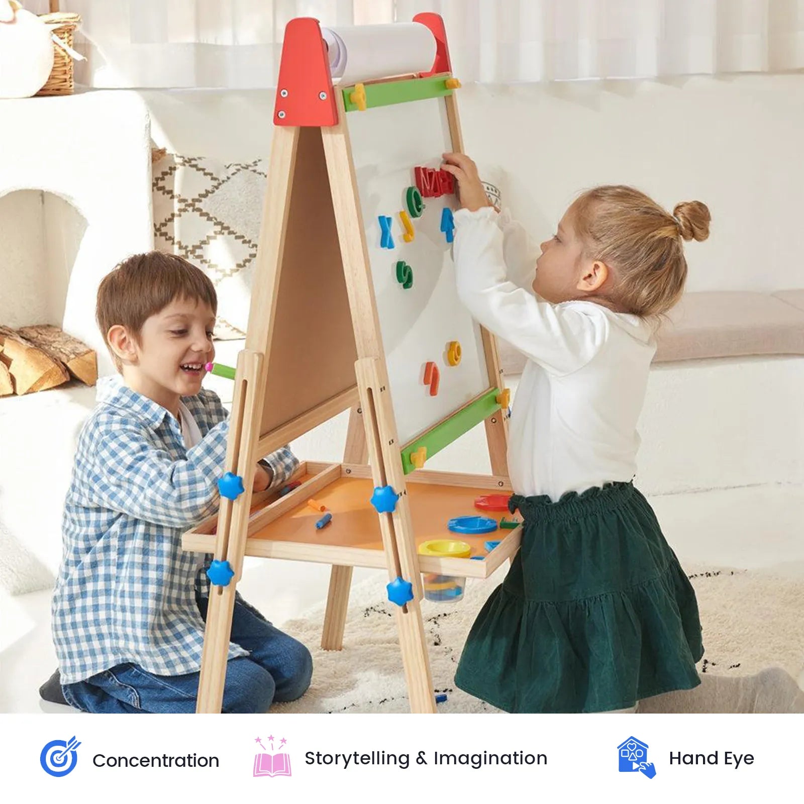 Two children play with the Tiny Land® 3-in-1 Art Easel for Kids, using its magnetic and drawing tools. The girl stands by the Tiny Land magnetic whiteboard chalkboard, arranging shapes, while the boy sits nearby and smiles. Sunlight streams through a window beside them.|red