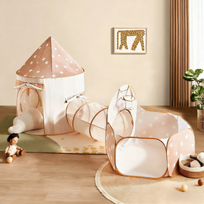 The Tiny Land® Compact Adventure 3-in-1 Play Tunnel sits on a wooden floor surrounded by toys, a plush doll, and soft balls, while a giraffe print decorates the wall. Note: Balls are not included with this Tiny Land product.|brown