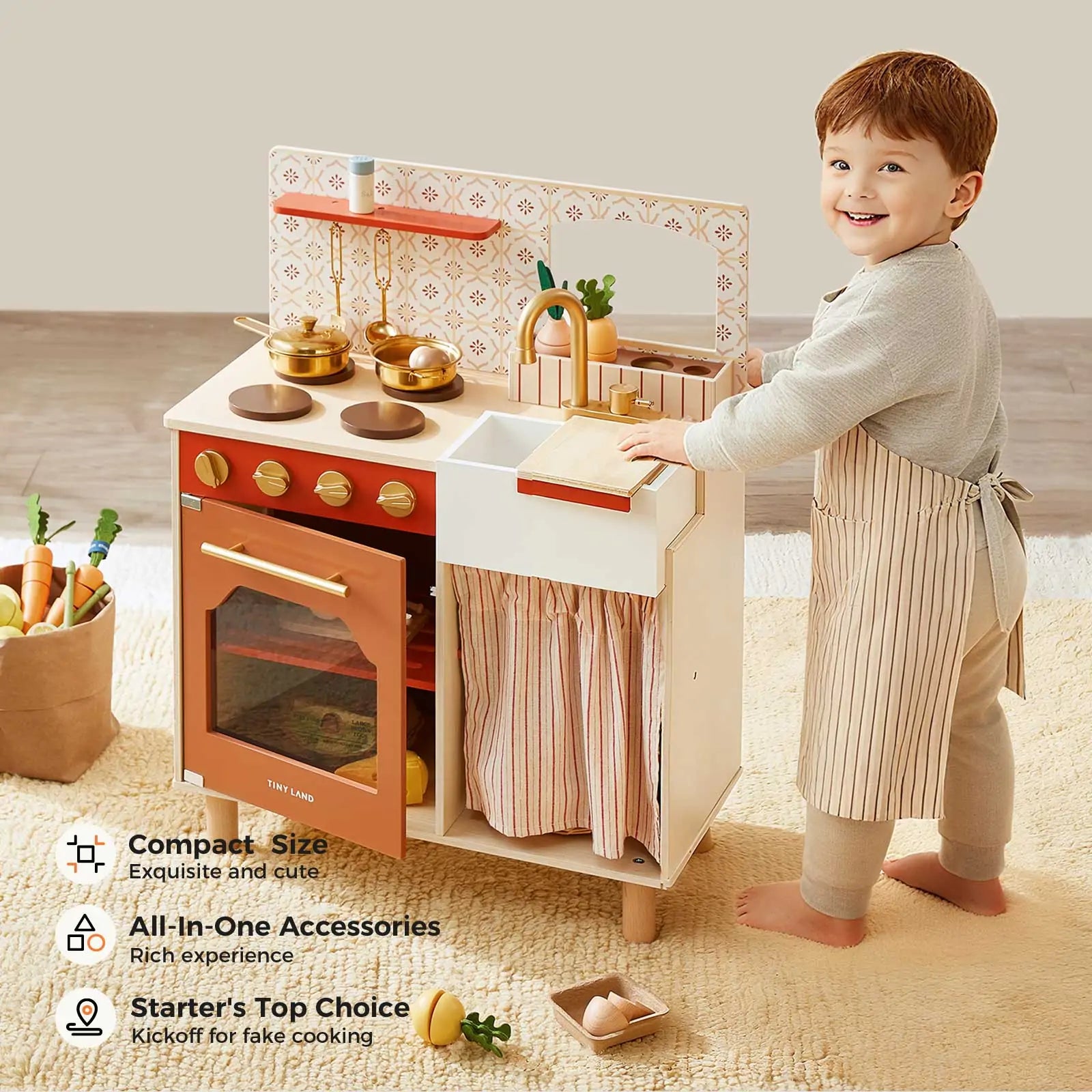 A young child in an apron plays with the Tiny Land® Mediterranean Play Kitchen by Tiny Land, a pastel wooden set featuring pots, utensils, an oven, toy food items, and text showcasing its stylish features|Mediterranean