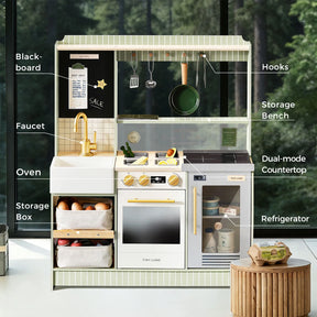 The Tiny Land® BistroSwitch Play Kitchen by Tiny Land includes labeled parts: blackboard, hooks, storage bench, faucet, oven, dual-mode countertop, and refrigerator—ideal for imaginative play in any space.|Green