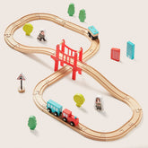 The Tiny Land® Wooden Track Trains by Target includes a figure-eight track, red bridge, two trains, trees, figures, signs, and buildings. This educational set is compatible with major brands for endless creative play.|39 Pcs