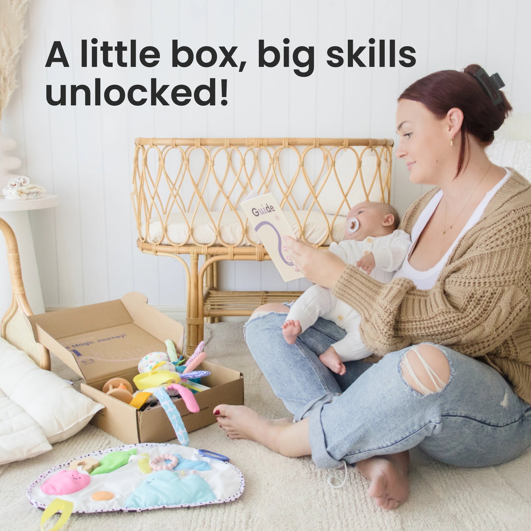 A mother sits with her baby and reads a guide as the Tiny Land® Montessori Toys for Newborns (0–3 Months) – including sensory toys and a colorful play mat for tummy time – await nearby. Text: A little box, big skills unlocked!.