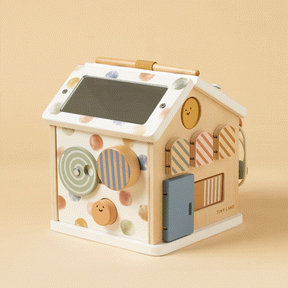The Tiny Land® Cottage Activity Cube - Morandi by Tiny Land is a developmental toy house that encourages hands-on learning and sparks curiosity about renewable energy with its built-in solar panel.