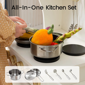 A child places vibrant felt vegetables into a stainless steel pot on the Tiny Land® Wooden Play Kitchen with Storage for Creative Toddlers, with the Tiny Land logo above and images of the included pot, lid, ladle, skimmer, and spatula below—ideal for any storage play kitchen or kids kitchen set.|cream