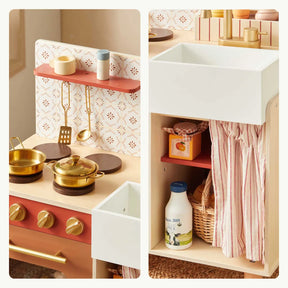 The Tiny Land® Mediterranean Play Kitchen by Tiny Land features gold pots, utensils, a stove, and sink. Red and white floral backsplash and shelves with a red-striped curtain add charm to this wooden toy kitchen set|Mediterranean