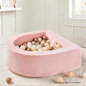 A Tiny Land® PlayNest Ball Pit - Ocean Ball Not Included by Tiny Land sits on a beige carpet, filled with pastel balls and some scattered outside. Text reads: Balls are NOT included.|pink