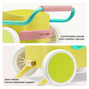 A close-up of the Tiny Land® 3-in-1 Wooden Baby Walker Wagon - Spring Color shows its yellow and green design, pink and teal handle with a comfortable silicone grip, silent wheels with backheel support, and adjustable speed control.
