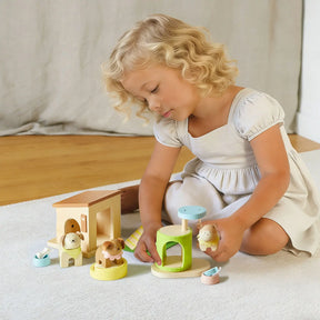 A young child enjoys the Tiny Land® Happy Urban Paws play set, creating a mini pet paradise. This cozy, bright setting from Tiny Land is perfect for kids' pretend play with animal toys.