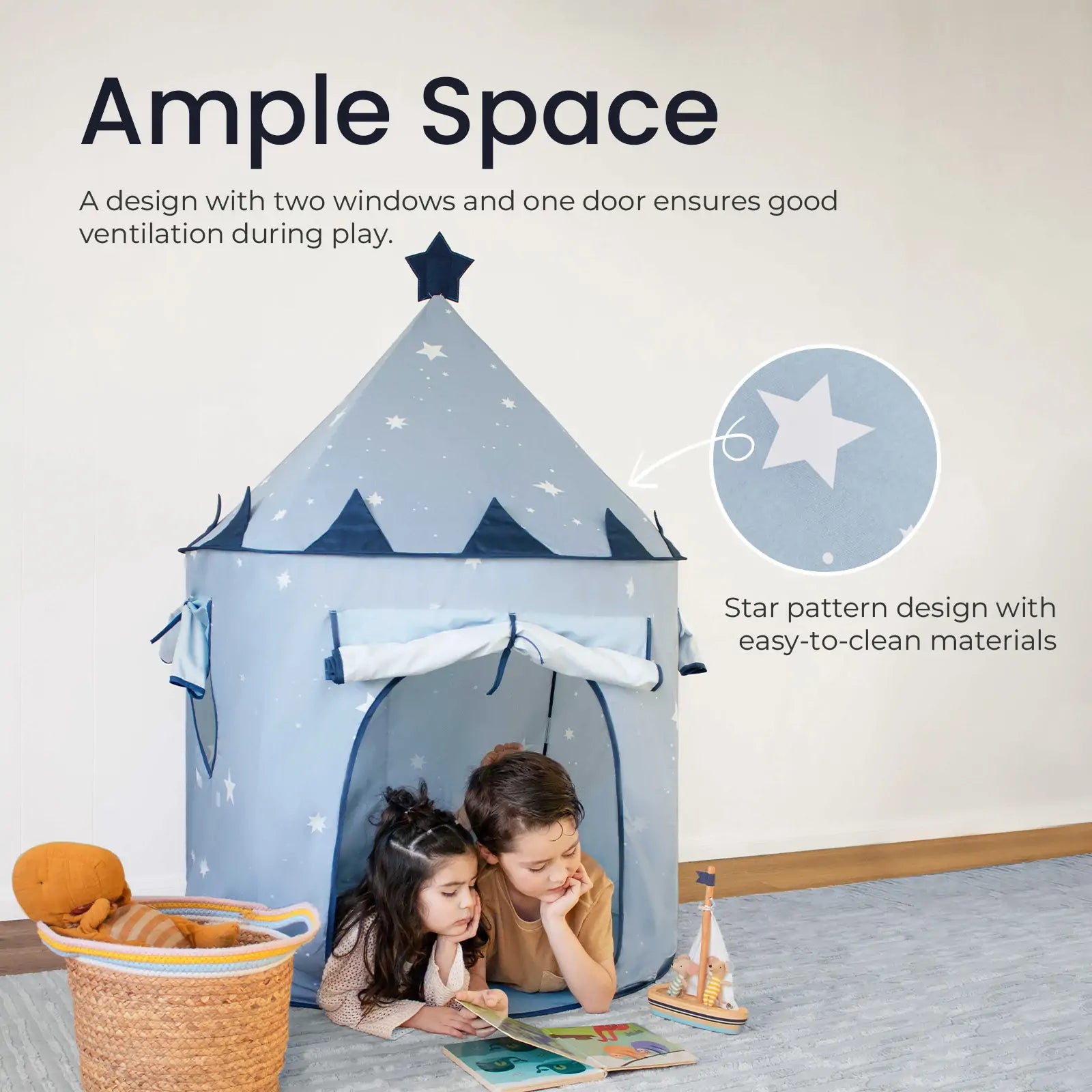 Two children read in front of the Tiny Land® Kids Tent – Starry Blue Indoor Tent for Toddlers, featuring star patterns, two windows, and a door. The spacious tent adds a cozy touch to the room alongside toys and a basket.|Blue