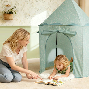 A woman kneels beside a young girl lying on a rug inside the Tiny Land® Tiny Sprout Castle Tent, reading a book together and creating a cozy reading nook.|Green