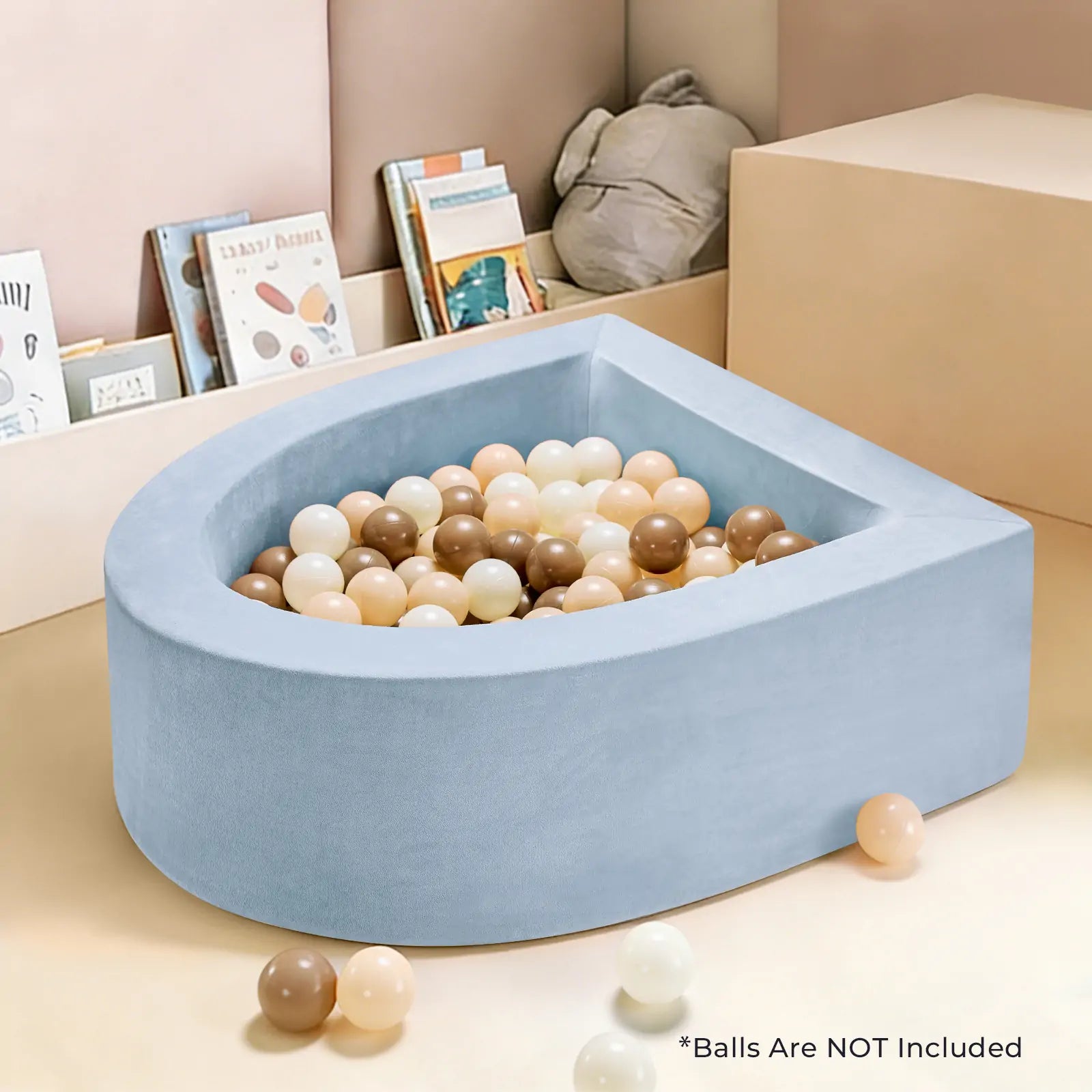A Tiny Land® PlayNest Ball Pit - Ocean Ball Not Included, in light blue, is filled with white, beige, and brown balls in a child's playroom with books and a plush toy. *Ocean Balls NOT included shown at the bottom right. Brand: Tiny Land.|blue