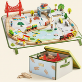 The Tiny Land® 110-Piece Wooden Train Set features tracks, trains, bridges, and toy figures arranged on a city play mat, with extra pieces and accessories stored in its folding storage box below.