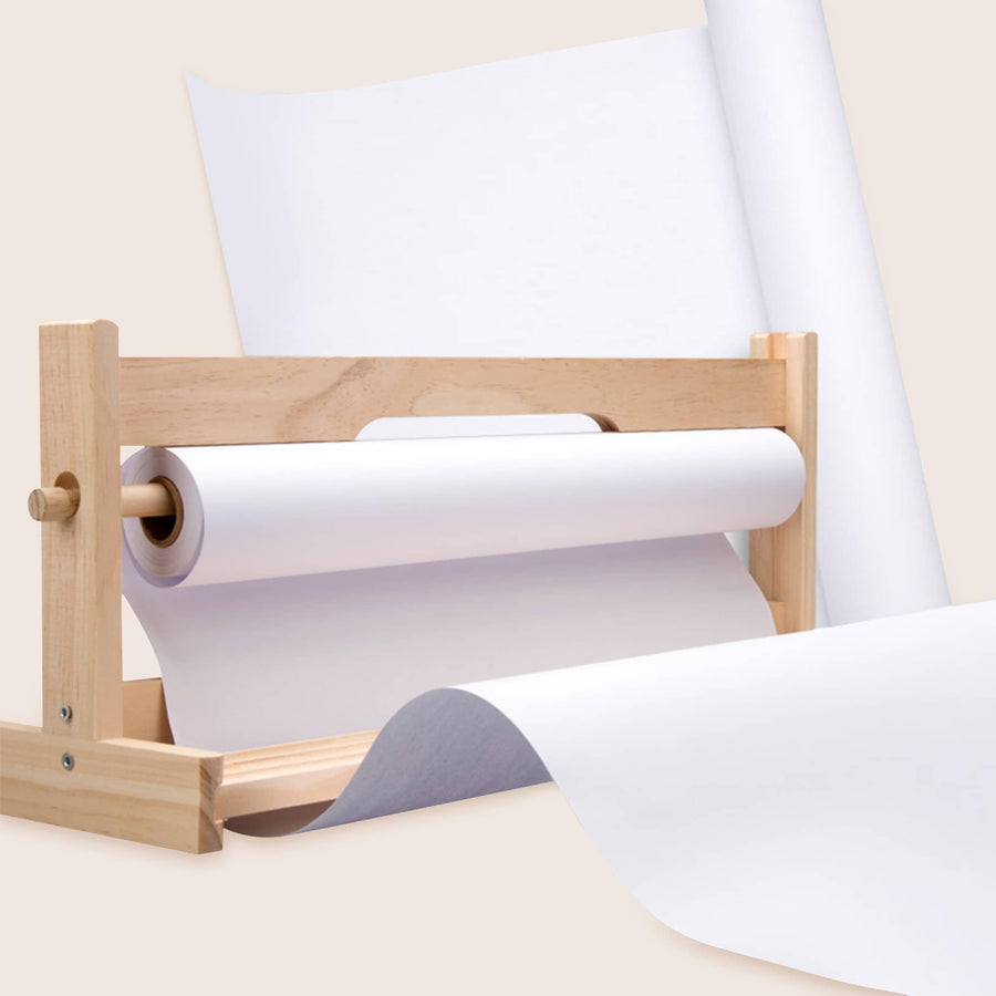 The Tiny Land® Easel Paper Roll (3 rolls) by Tiny Land features premium quality art paper, partially unrolled on a wooden holder, with additional paper rolls visible in the background against a light-colored surface.