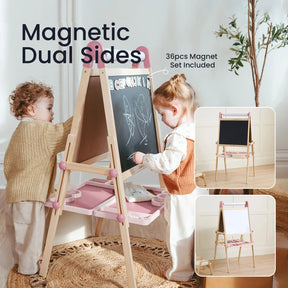 Two children draw on the Tiny Land® Magnitales Easel for Kids - Pink, a height-adjustable easel with magnetic chalkboard and whiteboard sides. Storage trays and magnetic pieces included. Insets show both sides with "Magnetic Dual Sides" text.|pink