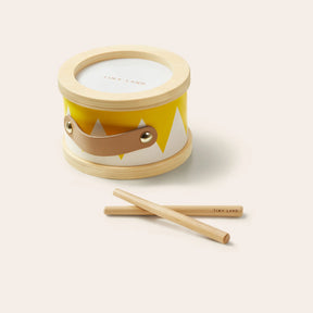The Tiny Land® Montessori Toys for Toddlers (13–15 Months) features a small wooden drum with a yellow and white zigzag design, brown leather handle, and two wooden drumsticks—perfect for early learning and sensory play.
