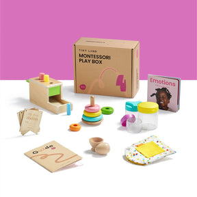 The Tiny Land® Montessori Toys for Infants (10–12 Months) by Tiny Land includes wooden toys, stacking rings, an Emotions book with a smiling child, activity cards, containers, a yellow cloth, and an instruction guide on a white surface.