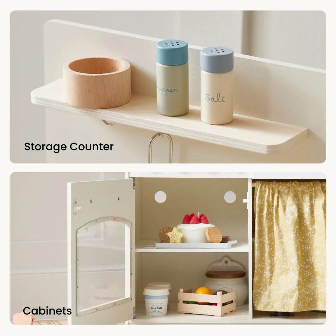 The Tiny Land® Wooden Play Kitchen for Toddlers features a shelf with wooden salt and pepper shakers and a cup, plus cabinets that hold toy food, a fruit basket, a jar, and have a fabric curtain—perfect for imaginative play|white
