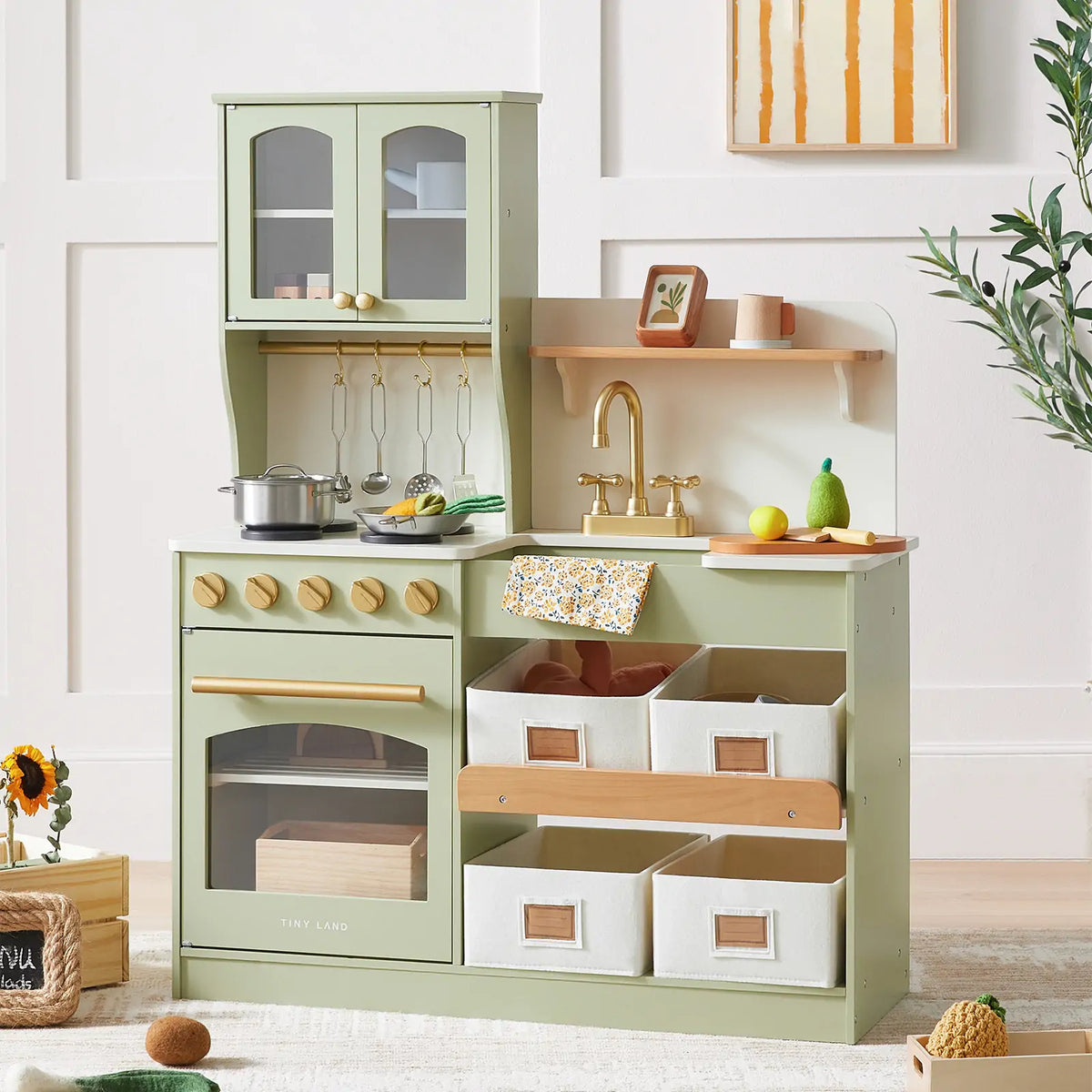 The Tiny Land® Serenity Wooden Kitchen for Kids in blue and green includes pretend cookware, a toy stove, oven, sink, utensils, shelves, storage bins, and playful decor—creating a light and stylish space for imaginative play.