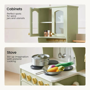 The Tiny Land® Wooden Play Kitchen with Storage for Creative Toddlers by Tiny Land features open cabinets displaying spice jars and utensils, along with a stovetop equipped with pretend cookware such as a pot and a frying pan filled with play vegetables.|sage