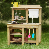 The Tiny Land® Mud Kitchen - DuoPlay Outdoor Play Kitchen for Kids by Tiny Land features shelves, a faucet, toy utensils, play food, and colorful scoops—plus a yellow watering can—perfect for sensory and outdoor adventures on the lawn.