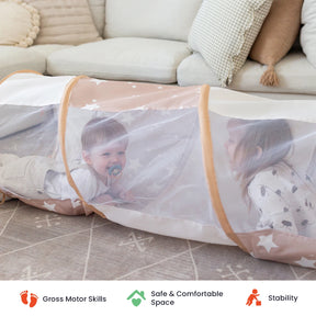 Two small children crawl through the Tiny Land® Adventure Play Tunnel by Tiny Land on a carpeted floor, with pillows and a couch in the background. This versatile play tunnel is perfect for both indoor and outdoor fun. Icons below highlight its support for gross motor skills, safety, and stability.|brown