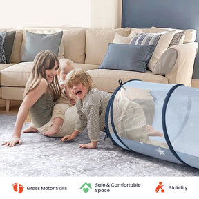 Two young children play on a gray rug near the Tiny Land® Adventure Play Tunnel by Tiny Land in blue, while an older girl smiles nearby. A beige couch with blue and gray pillows sits in the background. Icons below highlight skills and comfort.|Blue