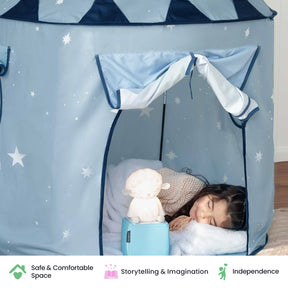 A young girl sleeps inside the Tiny Land® Kids Tent – Indoor Tent for Toddlers, surrounded by a soft toy lamp and a cozy pillow. Icons below highlight safe space, storytelling and imagination, and independence—showcasing how this charming play tent from Tiny Land creates the perfect indoor playhouse for little dreamers.|Blue