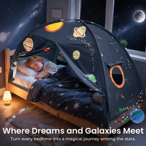 A young child sleeps under the Tiny Land® Kids Bed Tent by Tiny Land, designed with planets and stars to create an outer space feel. Soft lighting fills the room, while a starry sky glows outside. Text: Where Dreams and Galaxies Meet.|SPACENEST