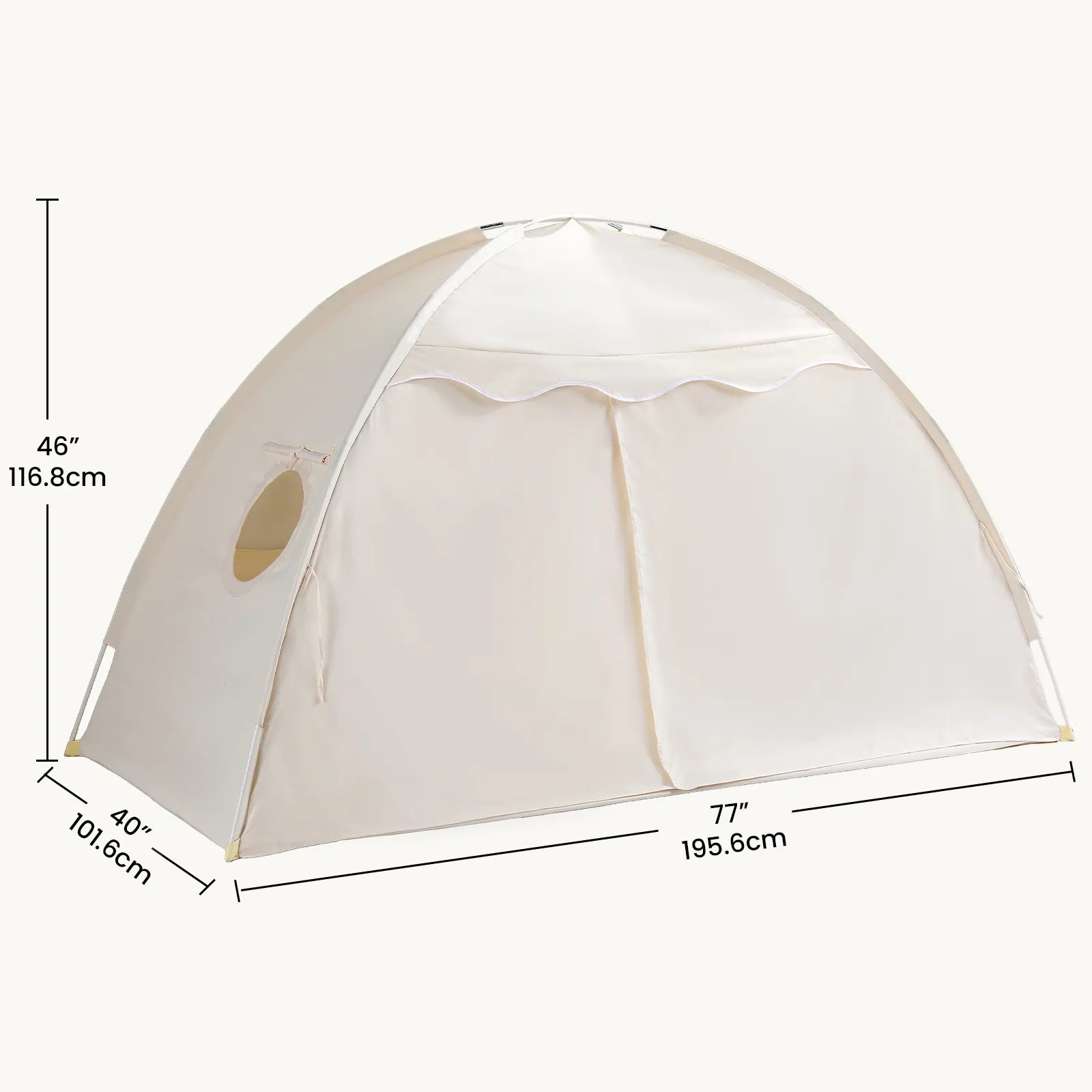 The Tiny Land® Versatile Kids Bed Tent & Play Tent by Tiny Land is a spacious cream-colored dome tent, perfect for use as an indoor tent for kids. Measuring 46" (116.8 cm) tall, 40" (101.6 cm) deep, and 77" (195.6 cm) wide, it features a zippered front flap and a small round window on one side—ideal for imaginative play and fun adventures.
