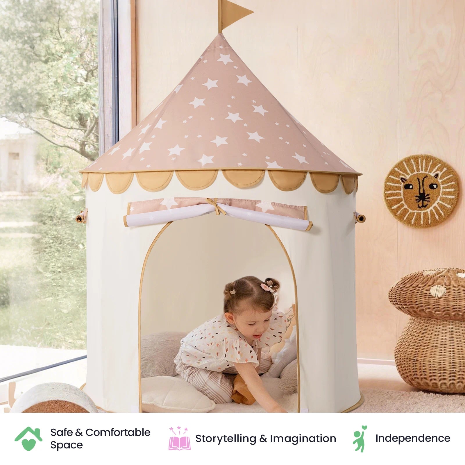 A toddler enjoys cozy playtime inside the Tiny Land® Kids Tent – Indoor Tent for Toddlers, nestled among plush cushions and favorite soft toys. The light wooden walls and playful lion face wall decor create a warm atmosphere, while icons highlight safety, imaginative play, and independent fun—making this Tiny Land tent the ideal indoor playhouse for little ones’ creative adventures.|Brown
