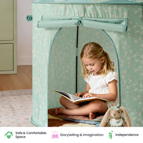 A young girl sits inside the Tiny Land® Kids Tent – Indoor Tent for Toddlers by Tiny Land, reading a book. Beside her is a plush rabbit toy dressed in a pretty outfit. Icons below emphasize safety, imagination, and independence.|Green