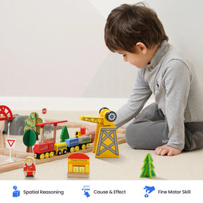 A young child sits on the floor playing with the Tiny Land® Wooden Train Set for Children by Tiny Land, crafted from sustainable wood. Icons and text below highlight benefits: Spatial Reasoning, Cause & Effect, and Fine Motor Skills. This train set is also compatible with popular wooden railway brands, providing endless opportunities for creative play.|55 Pcs