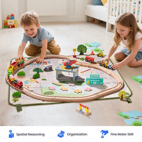 Two young children enjoy the Tiny Land® 110-Piece Wooden Train Set with Folding Storage Box, playing on a city-themed play mat in a bright, tidy room. Icons below showcase key benefits: spatial reasoning, organization, and fine motor skill development from Tiny Land.