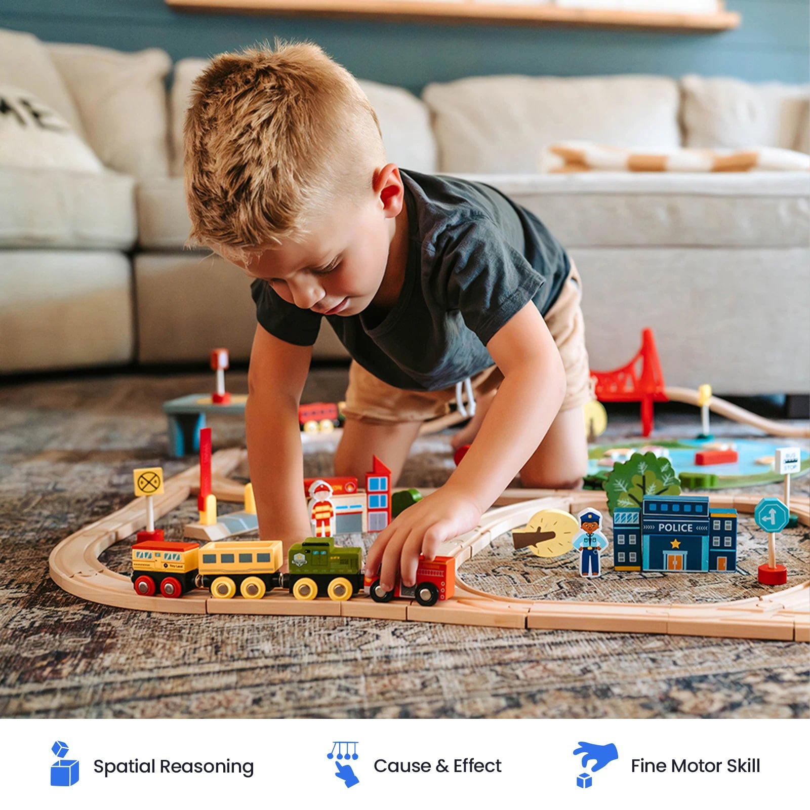A young boy plays with the Tiny Land® Wooden Train Set for Children by Tiny Land on the floor. The sustainable wooden track set includes buildings, signs, and a compatible toy train that works with other popular wooden railway brands. Educational icons below highlight benefits such as spatial reasoning, cause and effect understanding, and fine motor skill development.|110 Pcs