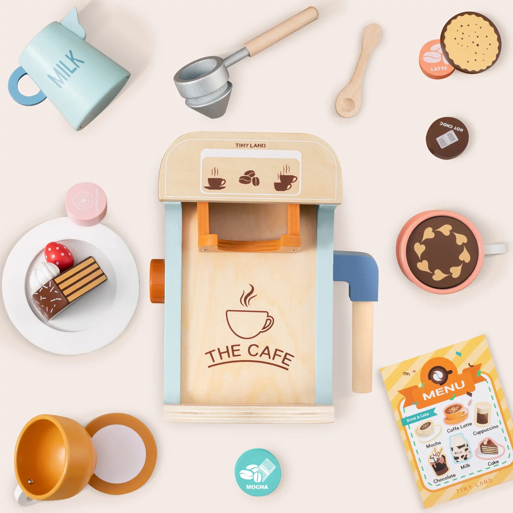 The Tiny Land® Smart Storage Kitchen Cafe Set by Tiny Land is a wooden play set with a coffee machine, cups, desserts, milk jug, coffee pods, spoon, menu, and more—ideal for pretend play in any child’s wooden play kitchen.