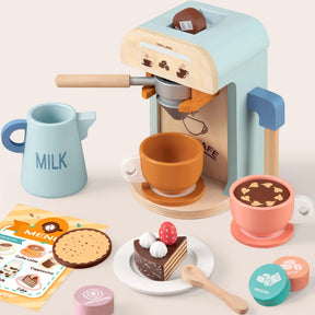 The Tiny Land® Luxury Kitchen Playset by Tiny Land includes wooden cups, milk jug, cookies, desserts, coffee pods, spoon, and a colorful menu—perfect for any wooden or pretend play kitchen fun on a pale surface.