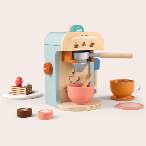 The Tiny Land® Play Kitchen Accessories – Children’s Coffee Maker set includes a wooden coffee machine, cups, spoon, cake plate with strawberries, and coffee pods—perfect for kids’ play kitchen collections.