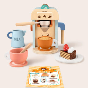 The Tiny Land® Play Kitchen Accessories – Children’s Coffee Maker Set includes a wooden coffee maker, milk jug, two cups (one with a spoon), cake slice with whipped cream and strawberry, and a menu card—perfect for kids’ kitchen play.