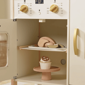 The Tiny Land® Farm-to-Table Play Set features an interactive kitchen with an oven, storage fridge, and organic food toys like a roast and cupcake—perfect for imaginative farm-to-table pretend play.