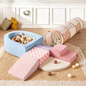 Transform your play area with the Tiny Land® Violet PlayNest Climbing Ball Pit Set with Tunnel by Tiny Land, featuring colorful foam steps, slides, a large ball pit filled with brown and white balls, a pink checkered mat, a round beige mat, a soft play tunnel, and cozy pillows on a beige rug—all in a bright indoor setting.|Blue