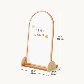 The Tiny Land® Double-Sided Arched Magnet Chalkboard by Tiny Land is a wooden-framed kids easel with an arch, featuring a magnetic chalkboard, colorful "Tiny Land" letters, and star. Measures 43.3" x 25.6" x 14.9".