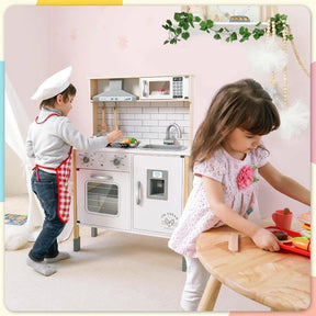 Two young children play with the Tiny Land® Interactive Play Kitchen with Sounds & Cookware, featuring an oven, sink, and fridge. One cooks at the stove in a chef hat while the other prepares toy food, sparking endless imaginative fun.