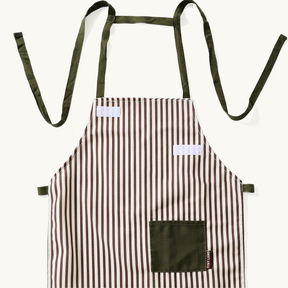 A striped apron with vertical brown and white lines, dark green ties, and a pocket—perfect for the Tiny Land® BistroSwitch Play Kitchen from Tiny Land.|White